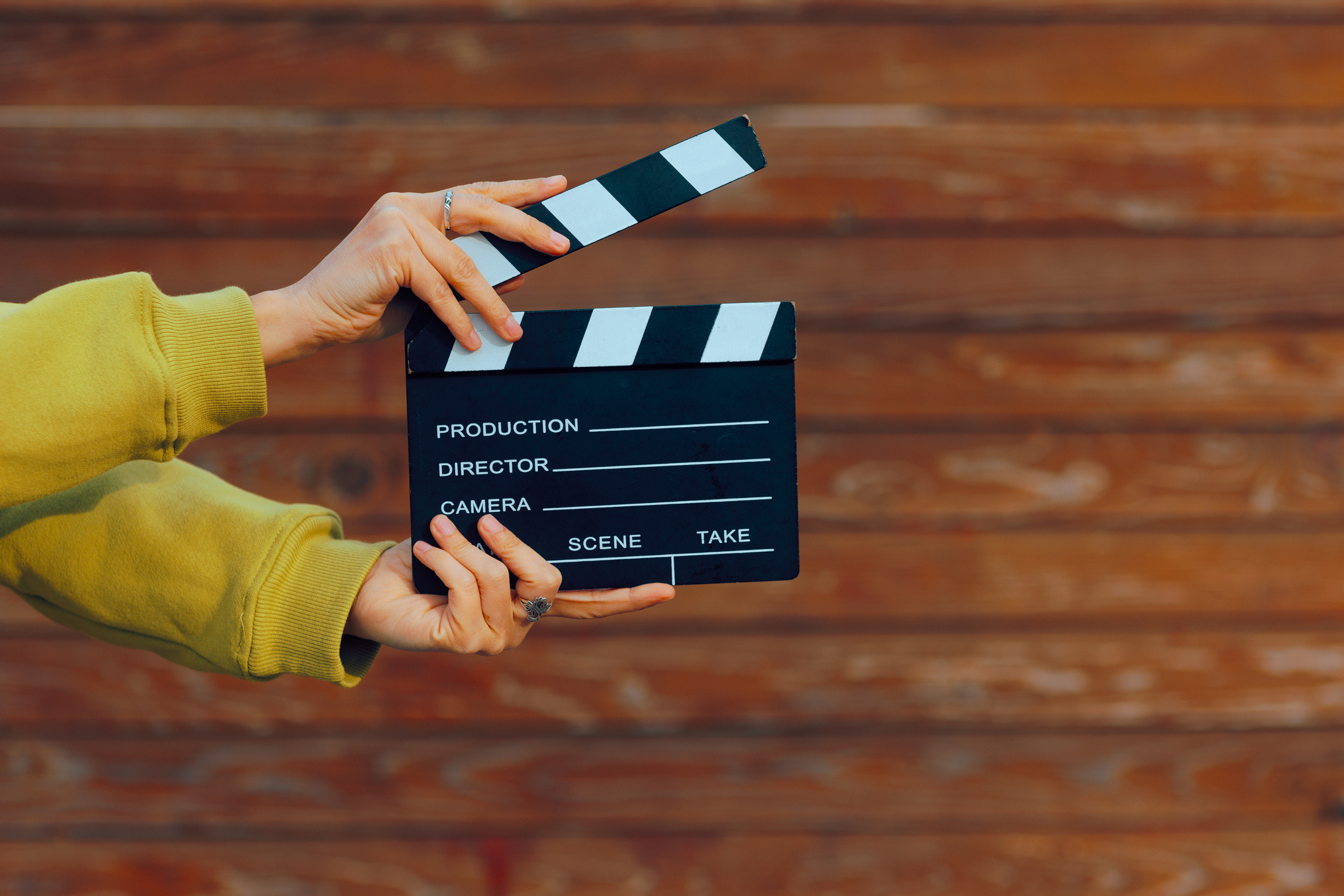 Hand holding a film slate