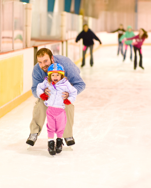 Dad and child skating