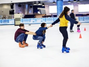 Friends skating in an Arena